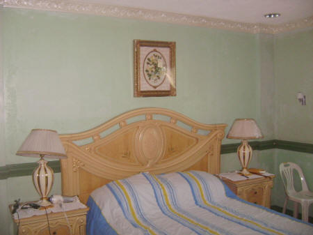 Italian headboard on master bedroom