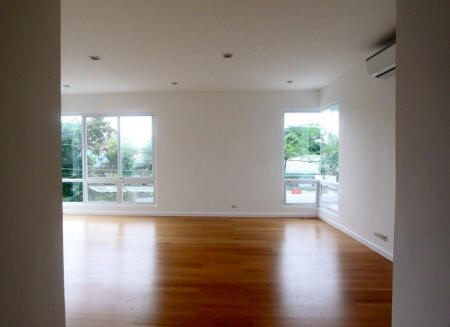 Master bedroom with wood laminate flooring