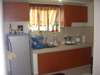 Kitchen with counter and hanging cabinets